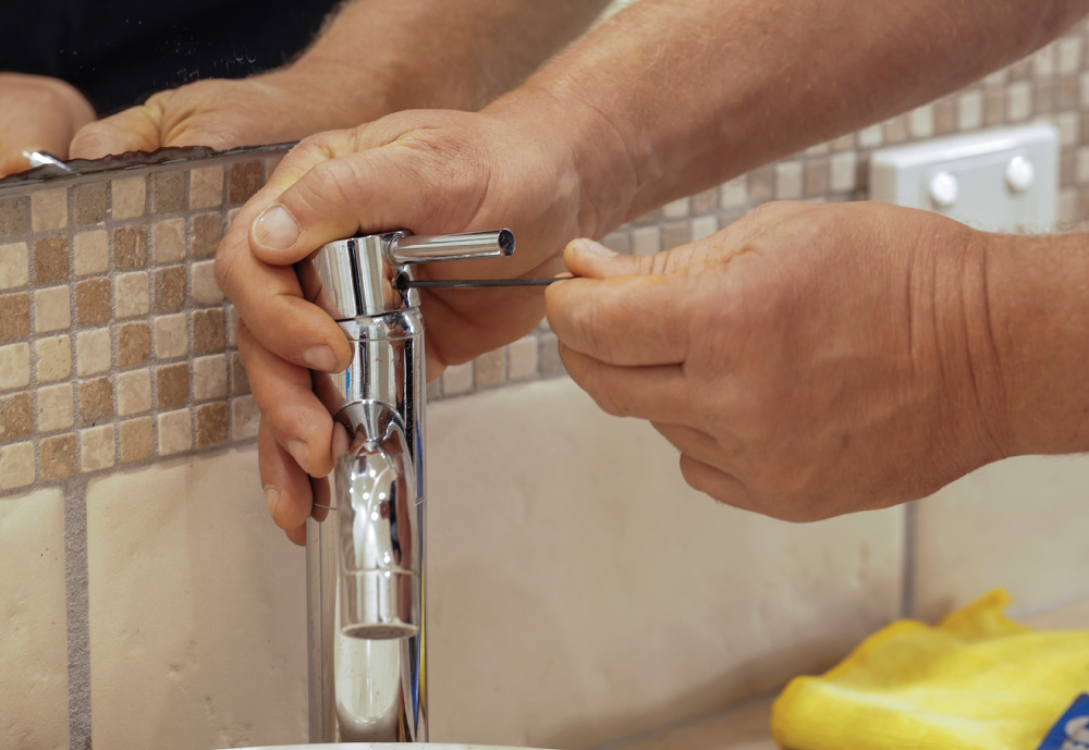 Damien Abbey fixing tap